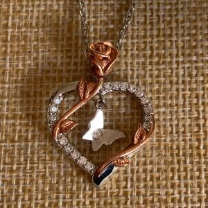 Enchanted necklace with rose, heart and butterfly. NWOT